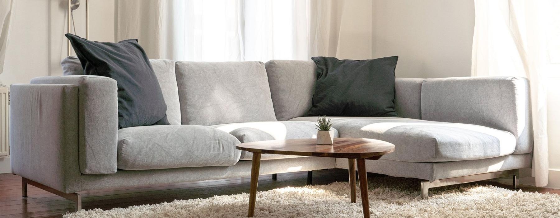 oversized windows brighten spacious, furnished living room